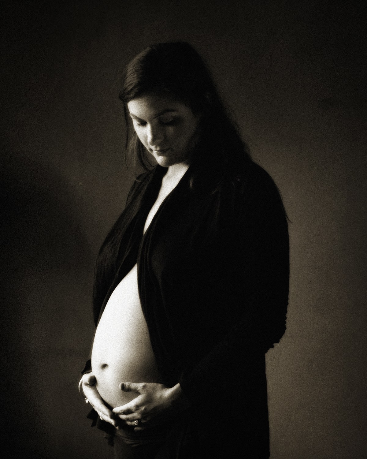 pregnant woman holding belly