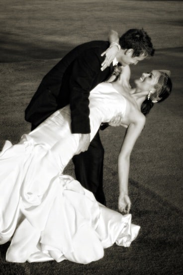 groom deeply dipping bride for a kiss